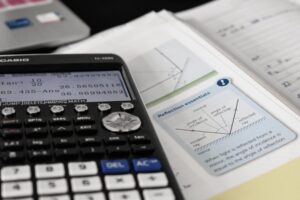 Calculator and study materials used for digital SAT math preparation and exam practice