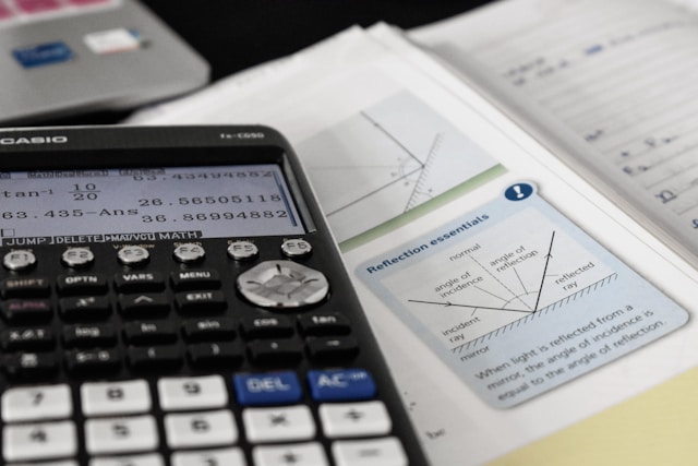 Calculator and study materials used for digital SAT math preparation and exam practice