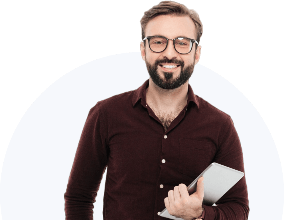 A smiling male professional instructor with a beard and glasses holding a tablet, representing Ostathi's career training.